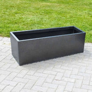Artfully arranged garden planters in bloom.